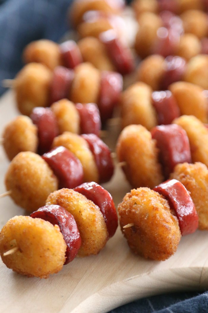 Fried cheese curds and sausage bites on toothpicks